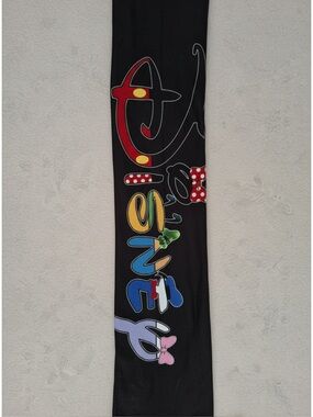 Women’s NWOT,  Black Leggings featuring Disney Character Logo down Left Leg